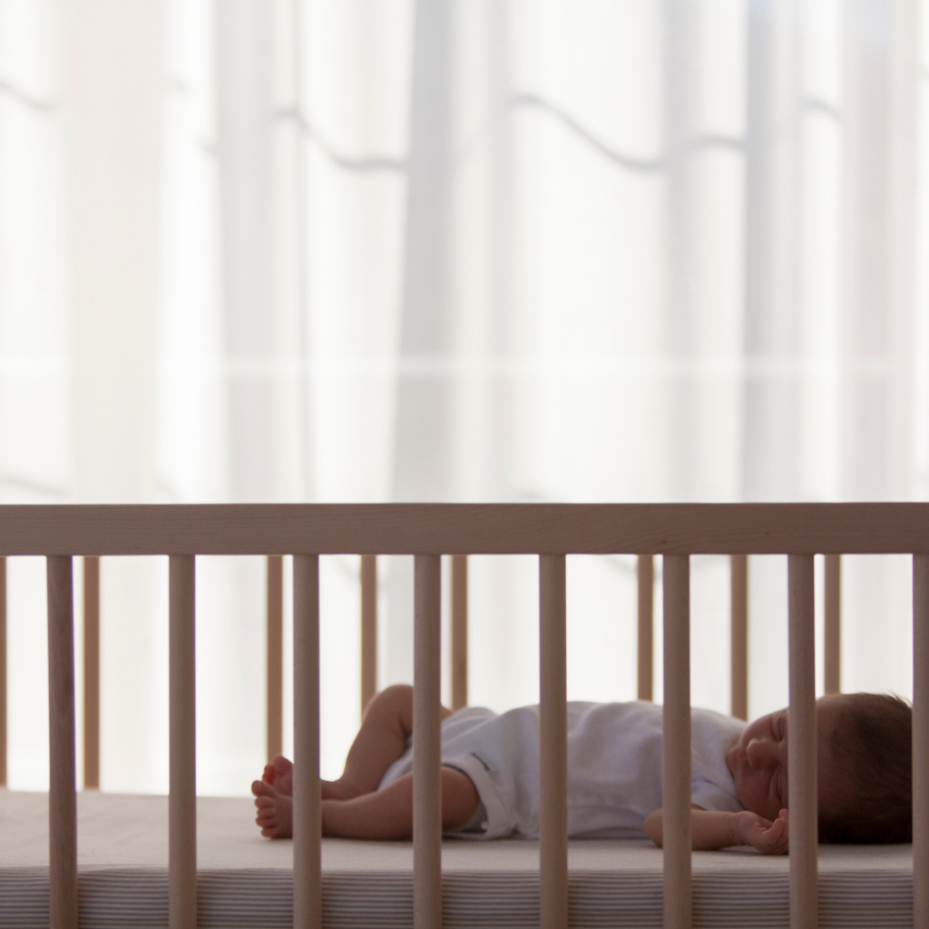 Newborn sleeping in safe sleep environment