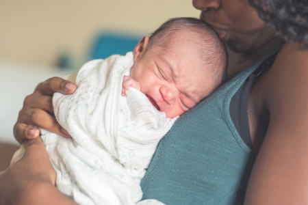 mom holding new baby